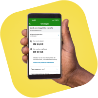Mão segurando um smartphone com o app PagBank aberto mostrando detalhes de venda